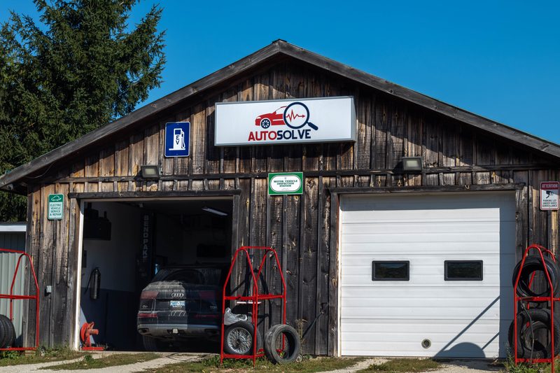 Auto Solve shop front — rustic barn-style garage