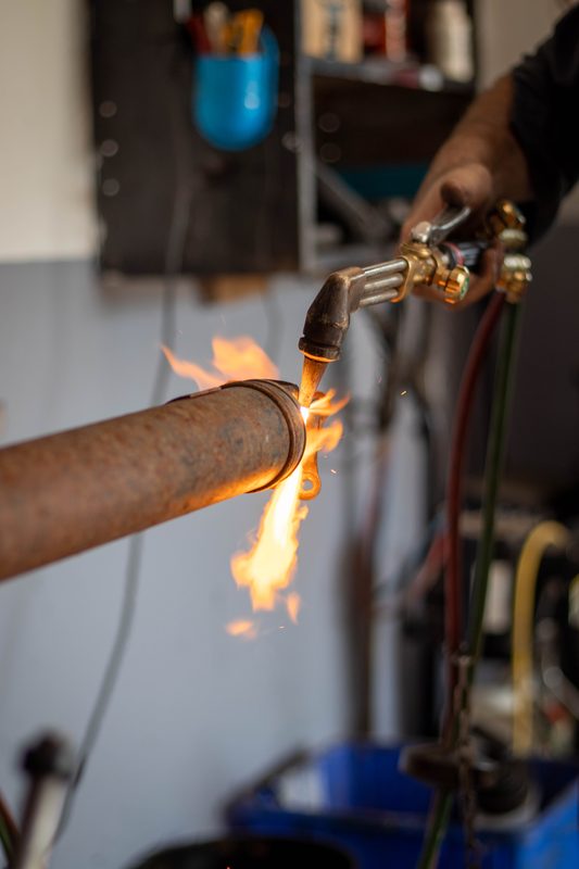 Torch cutting exhaust bracket