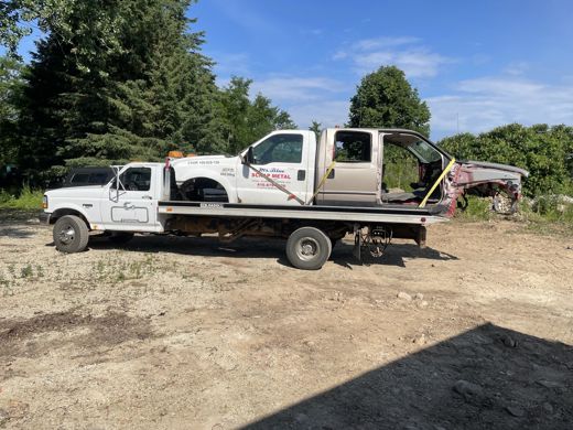 Auto Solve flatbed hauling a pickup truck