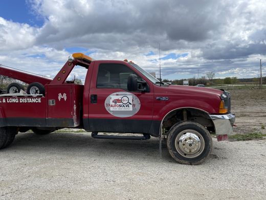 Red Auto Solve wrecker tow truck