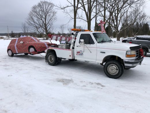 Auto Solve wrecker towing a car in winter