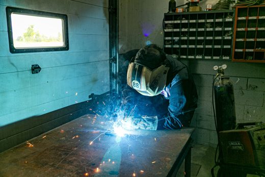 Welder at work with a bright arc and sparks